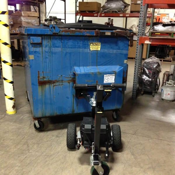 dumpster mover pulling dumpster