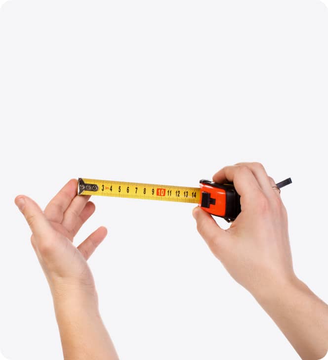 hands holding out a tape measure