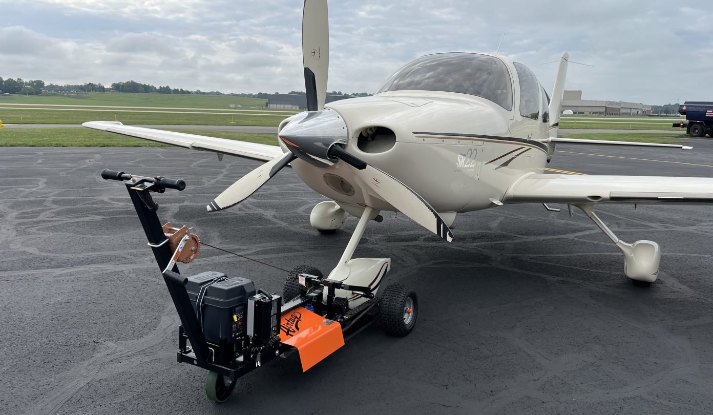 airtug aircraft tug pulling a plane