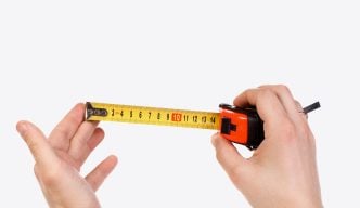 hands holding out a tape measure