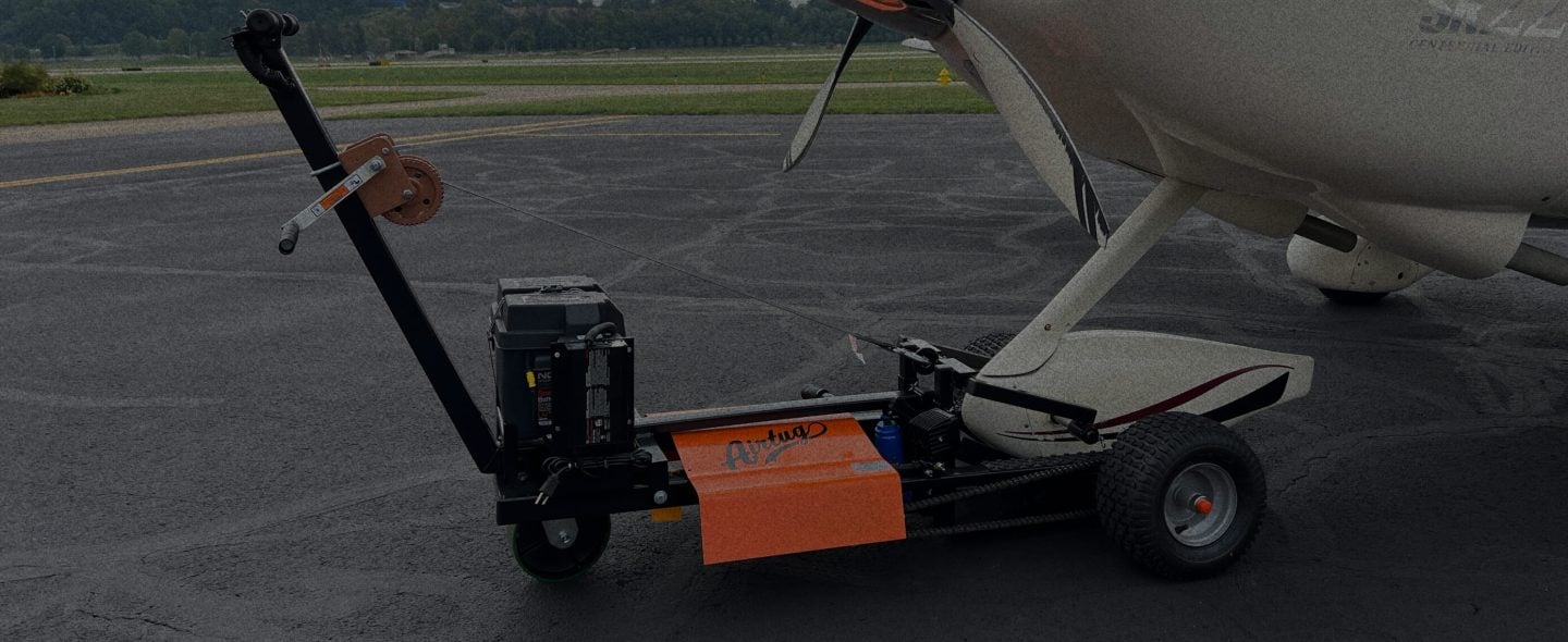 close up of airtug attached to plane